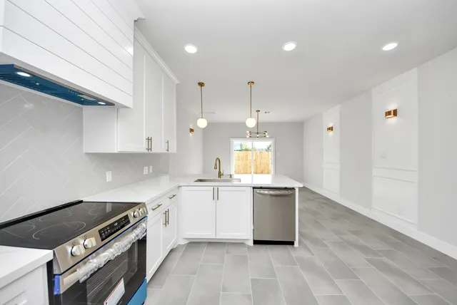 a kitchen with a stove and a sink