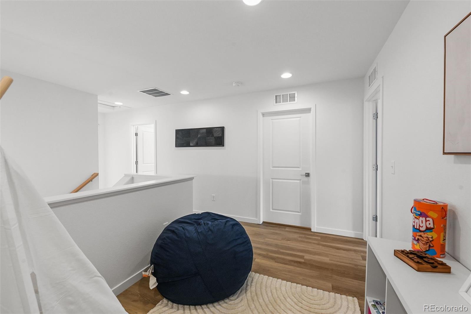1314 Akron Street Aurora, CO 80010 - Photo 20 of 29 a bedroom with a bed and cabinets