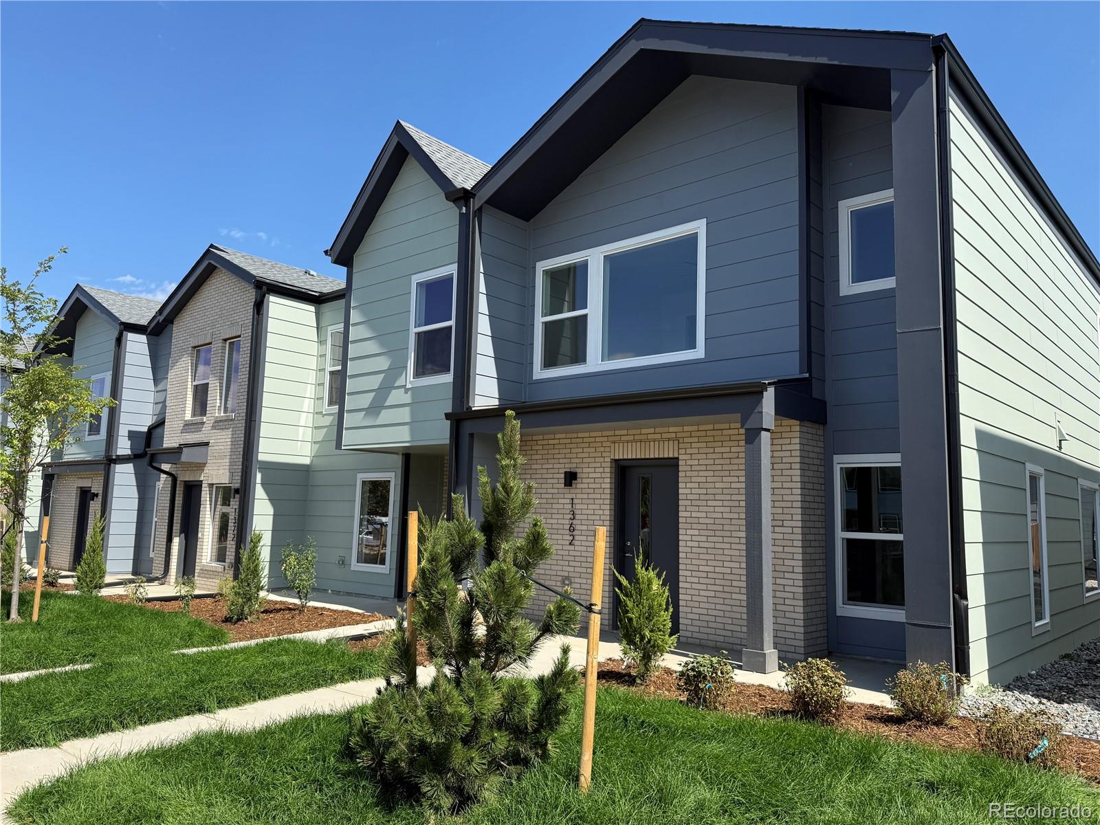 1314 Akron Street Aurora, CO 80010 - Photo 27 of 29 a front view of a house with a yard