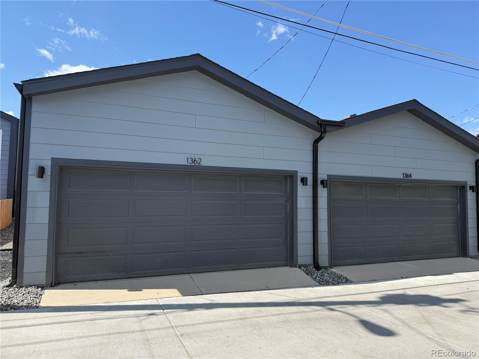 1314 Akron Street Aurora, CO 80010 - Photo 28 of 29 a front view of a house with garage