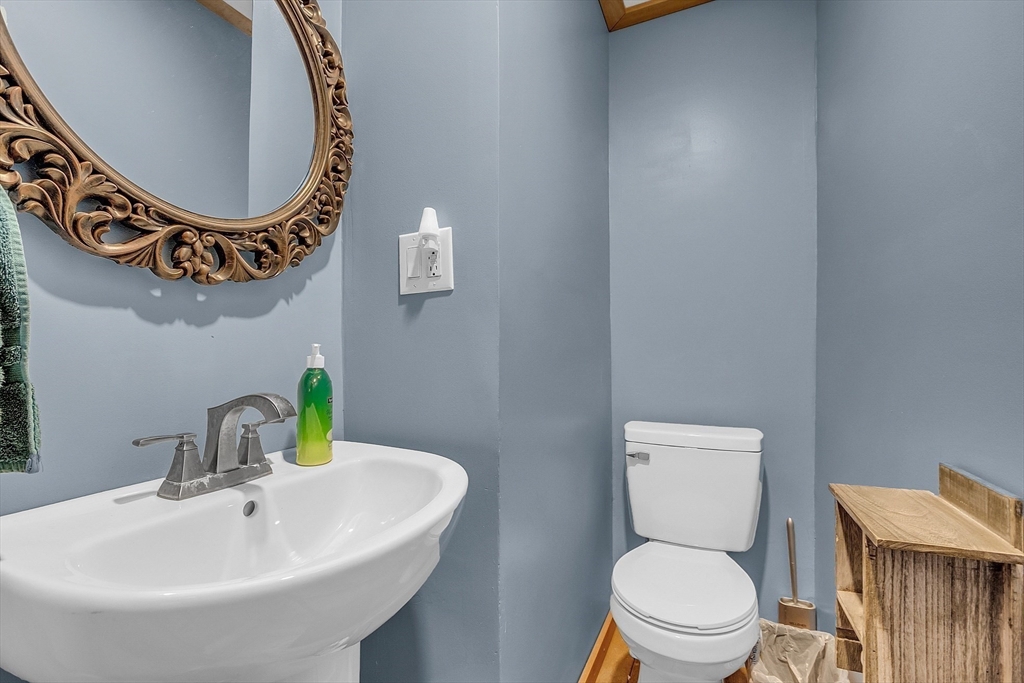 41 Orange Road Warwick, MA 01378 - Photo 20 of 42 a bathroom with a toilet a sink and a mirror
