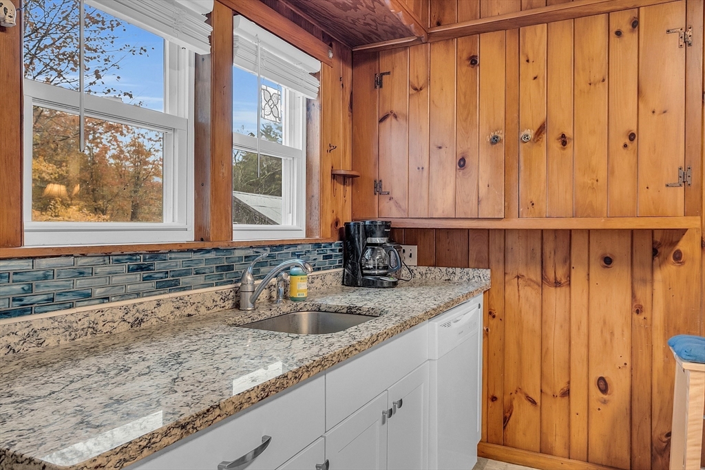 41 Orange Road Warwick, MA 01378 - Photo 4 of 42 a bathroom with a granite countertop sink and a mirror