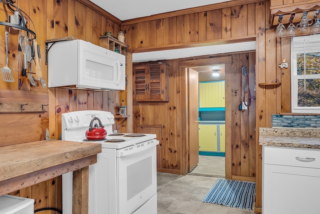 41 Orange Road Warwick, MA 01378 - Photo 6 of 42 a kitchen with refrigerator and cabinets