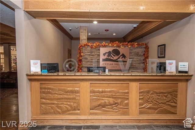 223 Hunter Ridge Drive, Unit E121 Brian Head, UT 84719 - Photo 24 of 35 Reception area with ornamental molding and a bar