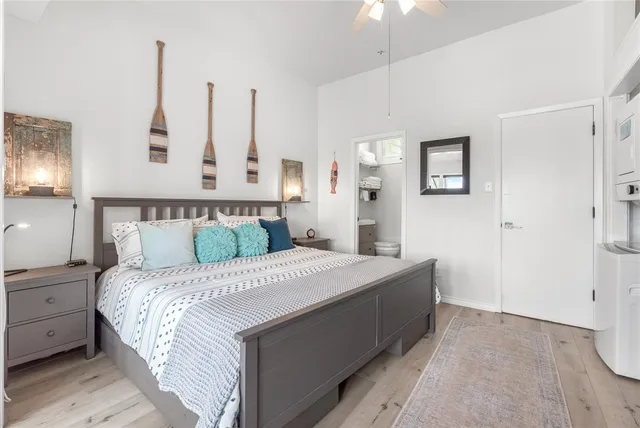 a bedroom with a bed and a night stand