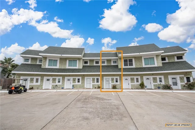 a view of entryway with furniture and wooden floor
