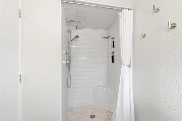 a kitchen with cabinets and chairs