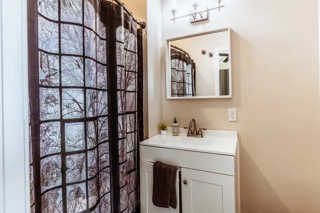 a bedroom with a bed and a book shelf