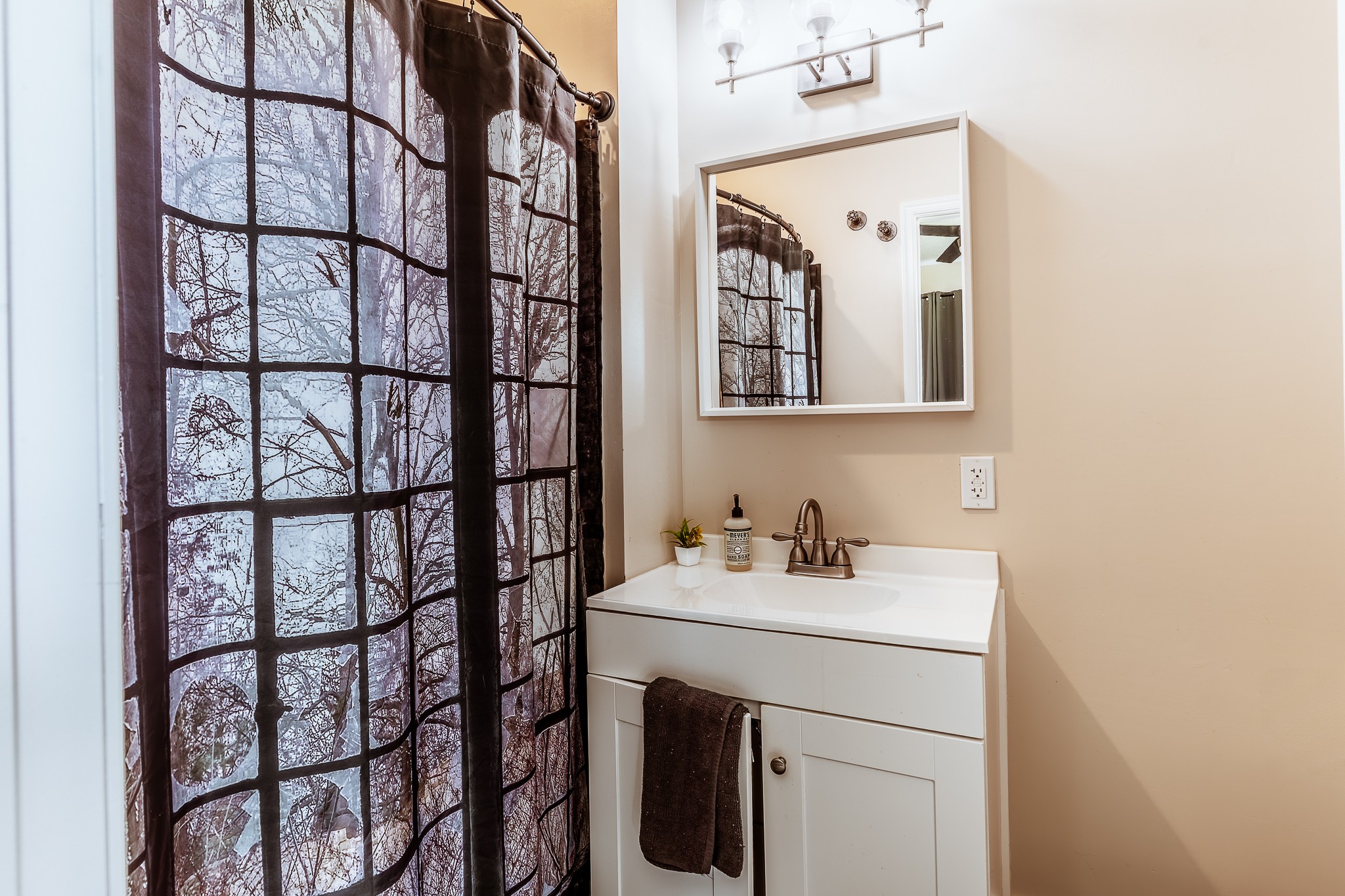 3375 Rowland Mill Road Buena Vista, TN 38318 - Photo 27 of 85 a bathroom with a sink and a mirror