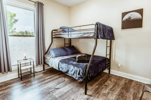 a dining room with furniture and wooden floor