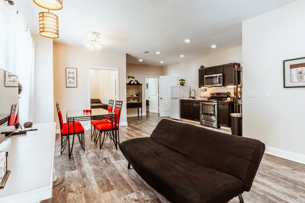a utility room with cabinets washer and dryer