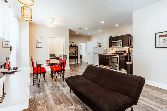 a utility room with cabinets washer and dryer