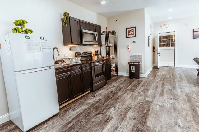 a big house with a big yard and large trees