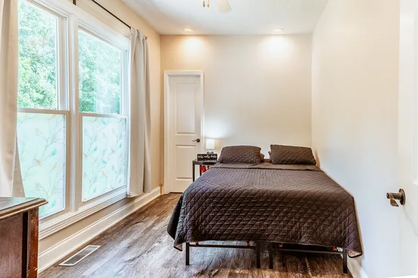 a house with trees in the background