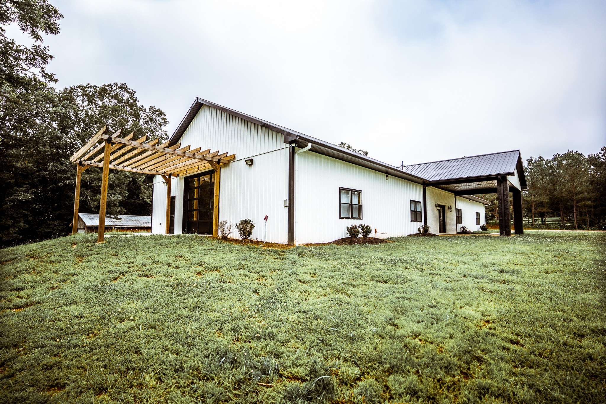 3375 Rowland Mill Road Buena Vista, TN 38318 - Photo 4 of 85 a house with green field in front of it