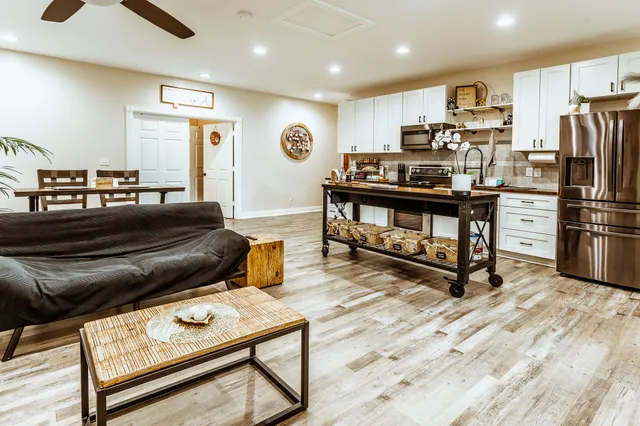 a backyard of a house with large trees and a big yard