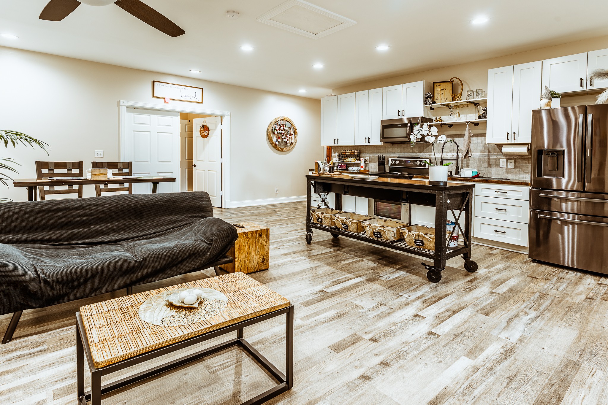 3375 Rowland Mill Road Buena Vista, TN 38318 - Photo 47 of 85 a living room with furniture a kitchen view and a refrigerator