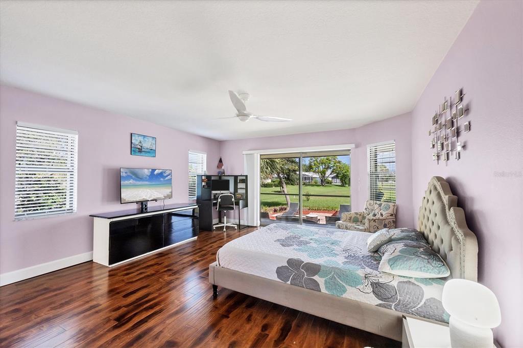 4 Leeward Drive Placida, FL 33946 - Photo 16 of 37 a bed room with furniture window and wooden floor