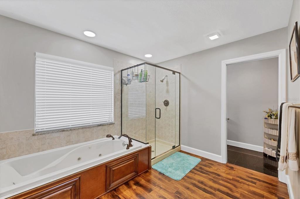 4 Leeward Drive Placida, FL 33946 - Photo 19 of 37 a bathroom with a tub a sink and a shower