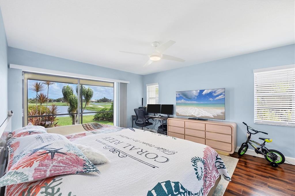 4 Leeward Drive Placida, FL 33946 - Photo 20 of 37 a bedroom with a bed a large window with table and chairs