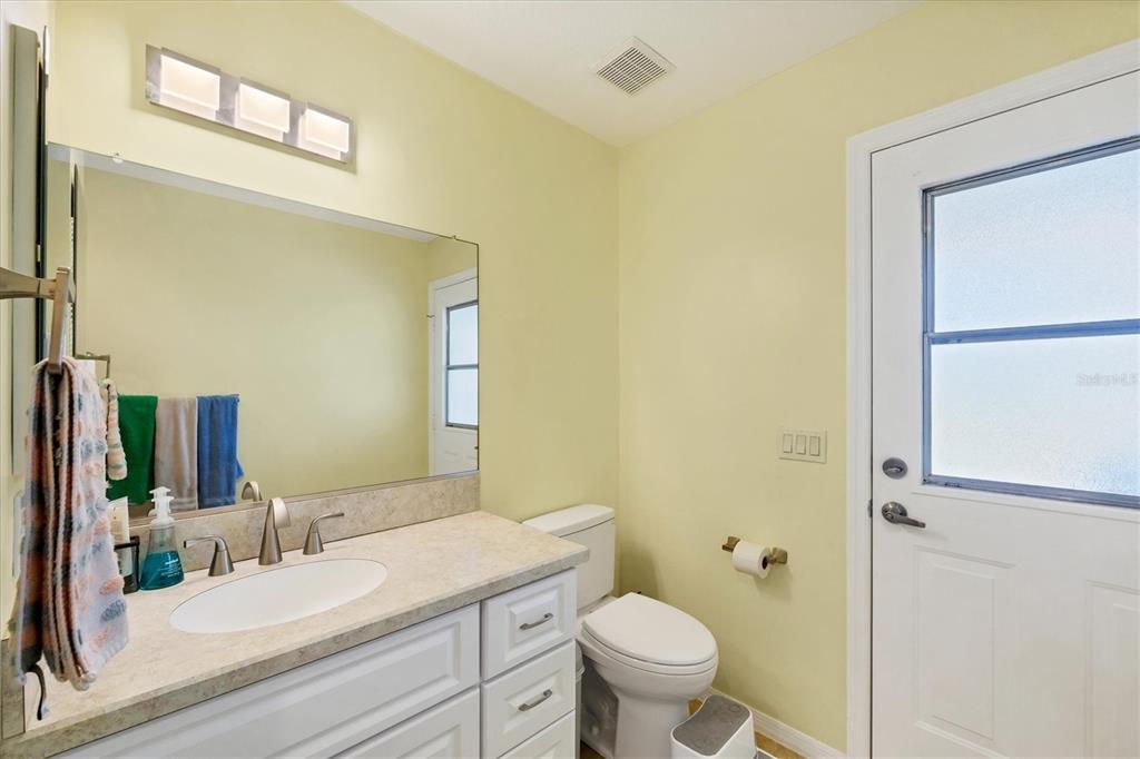 4 Leeward Drive Placida, FL 33946 - Photo 21 of 37 a bathroom with a granite countertop sink mirror vanity and toilet