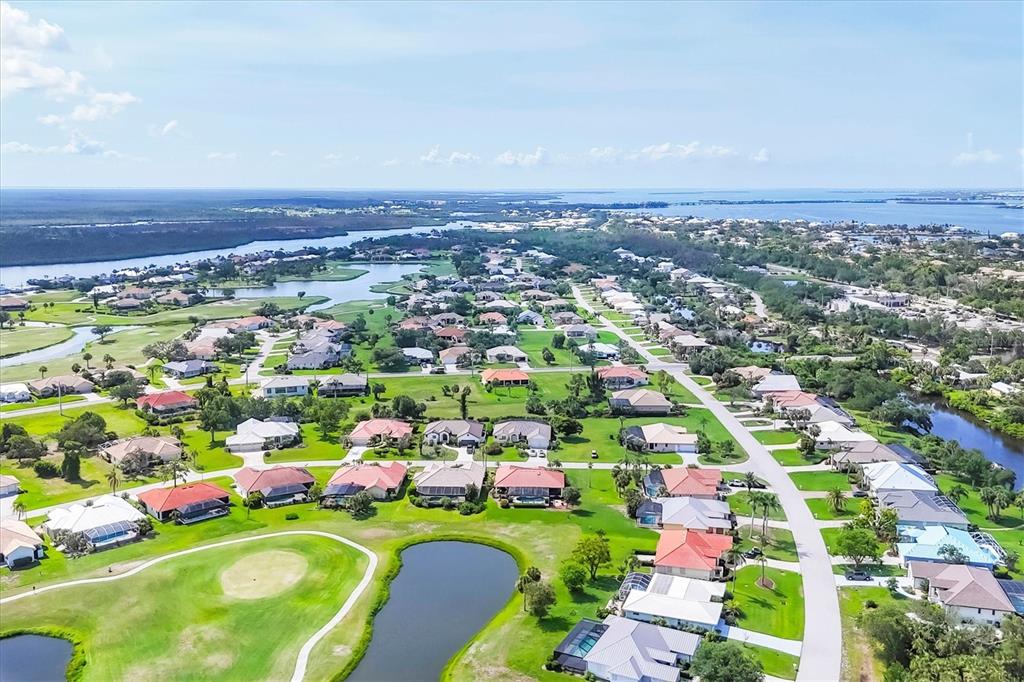 4 Leeward Drive Placida, FL 33946 - Photo 35 of 37 an aerial view of a city with lots of residential buildings and mountain view in back