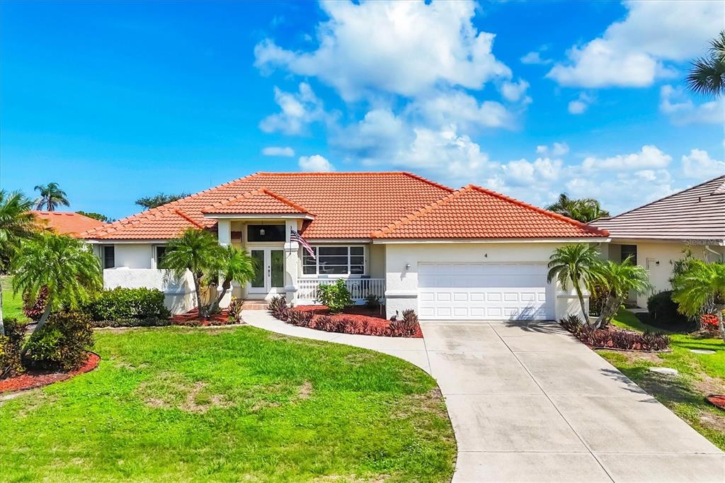 4 Leeward Drive Placida, FL 33946 - Photo 5 of 37 a front view of a house with garden