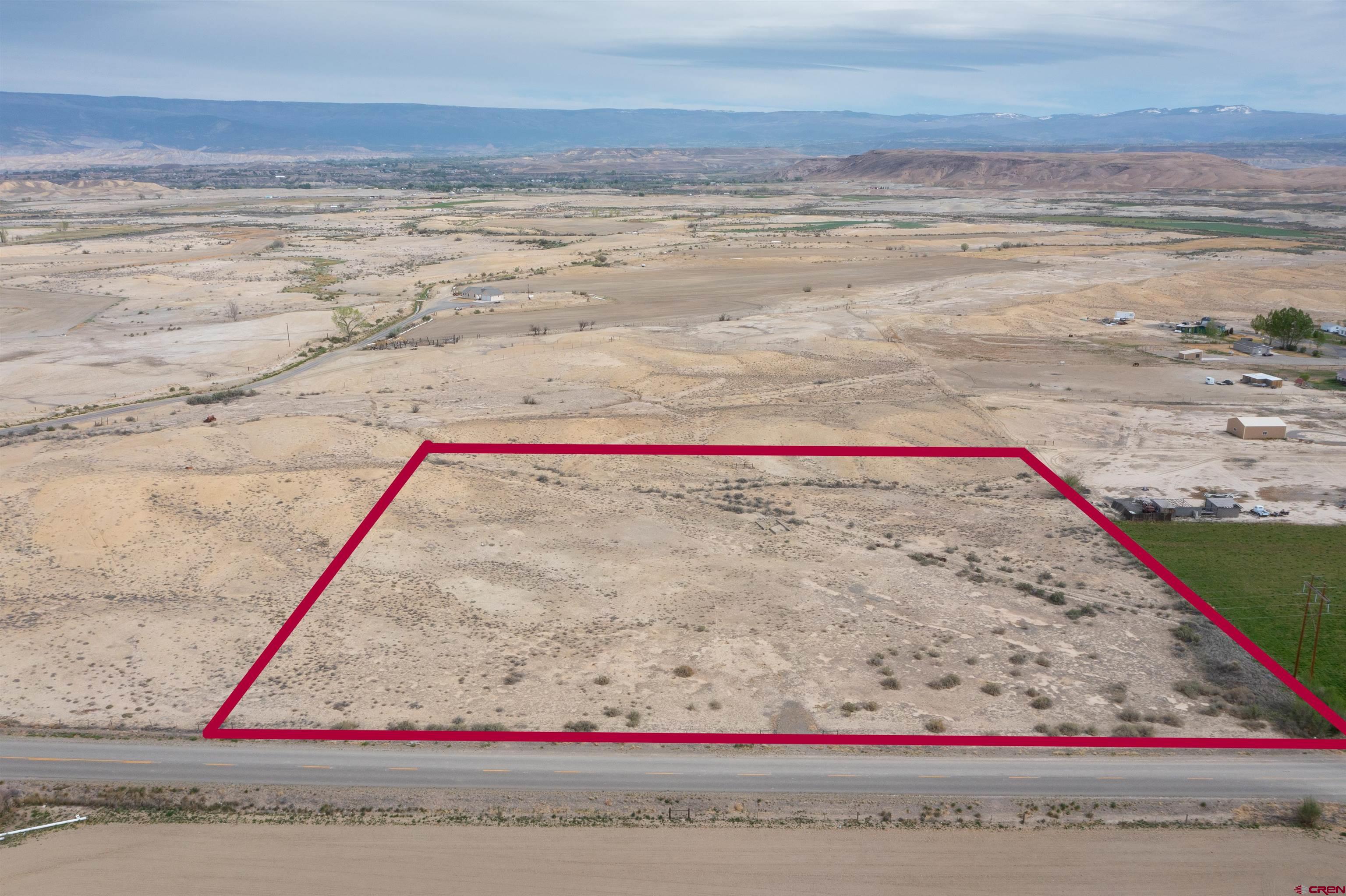 22477 F Road Delta, CO 81416 - Photo 2 of 35 a white and red and white on the side of a field