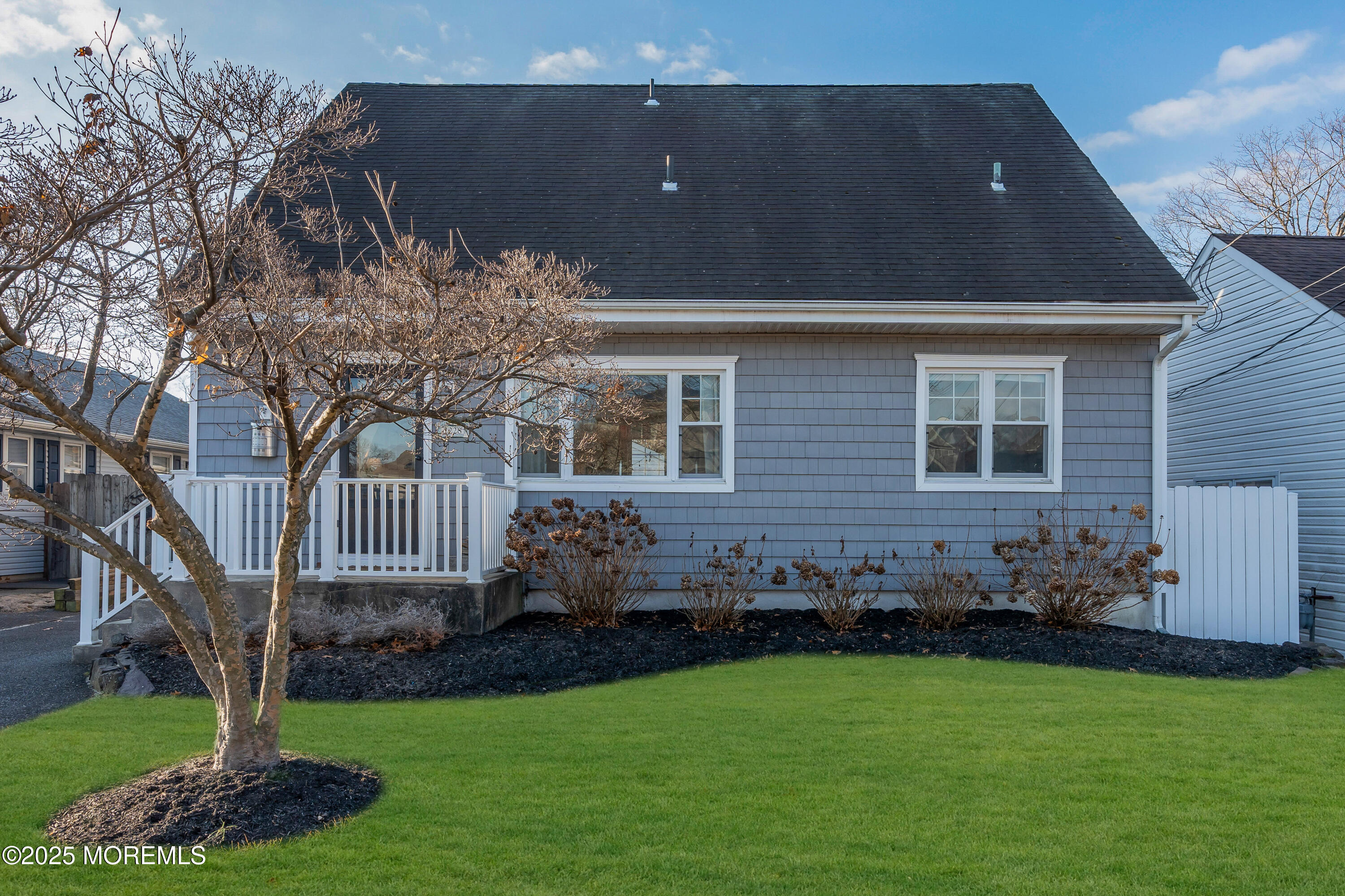 2228 Wilson Road Point Pleasant, NJ 08742 - Photo 1 of 65 a front view of a house with garden