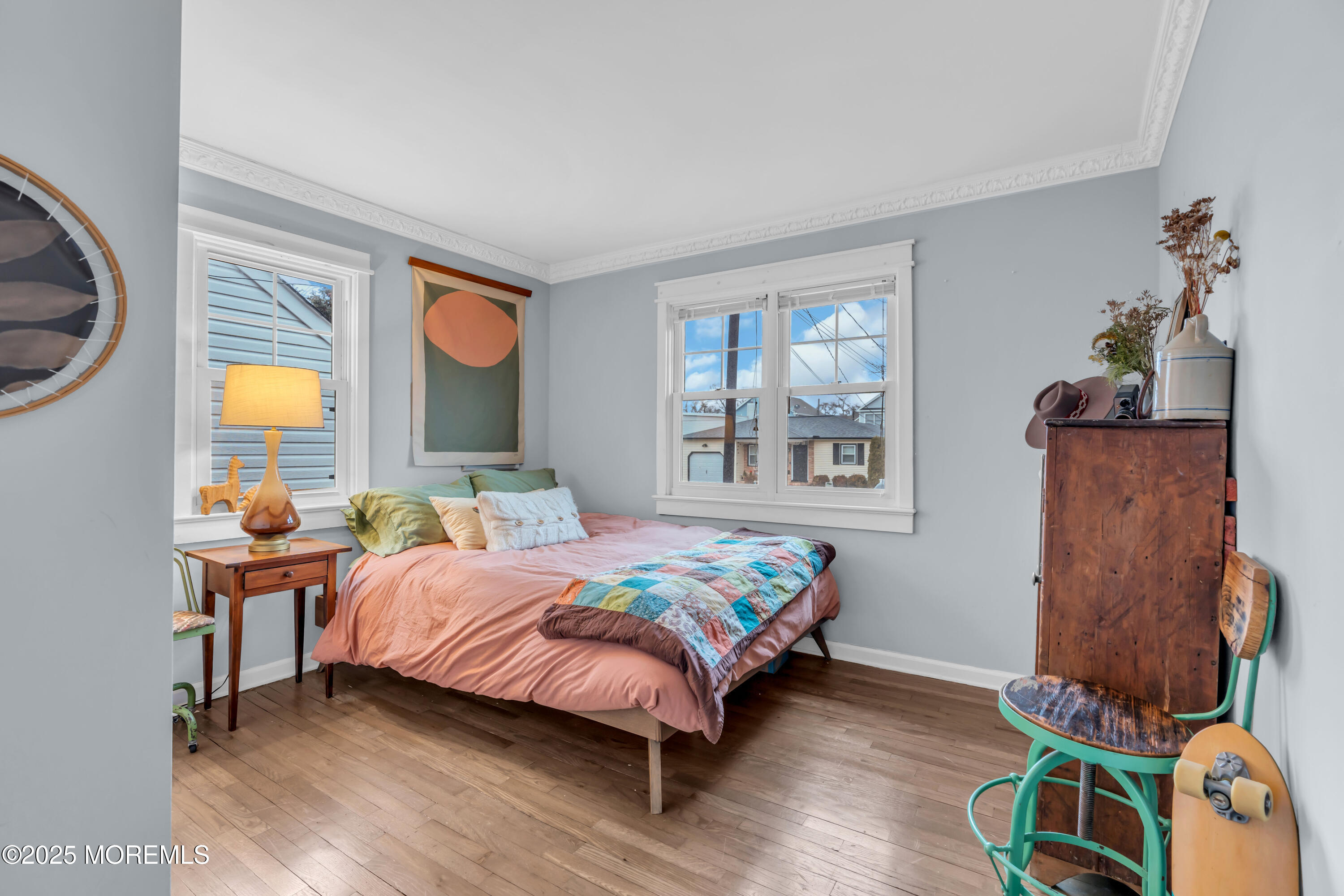 2228 Wilson Road Point Pleasant, NJ 08742 - Photo 32 of 65 a bedroom with a bed and wooden floor