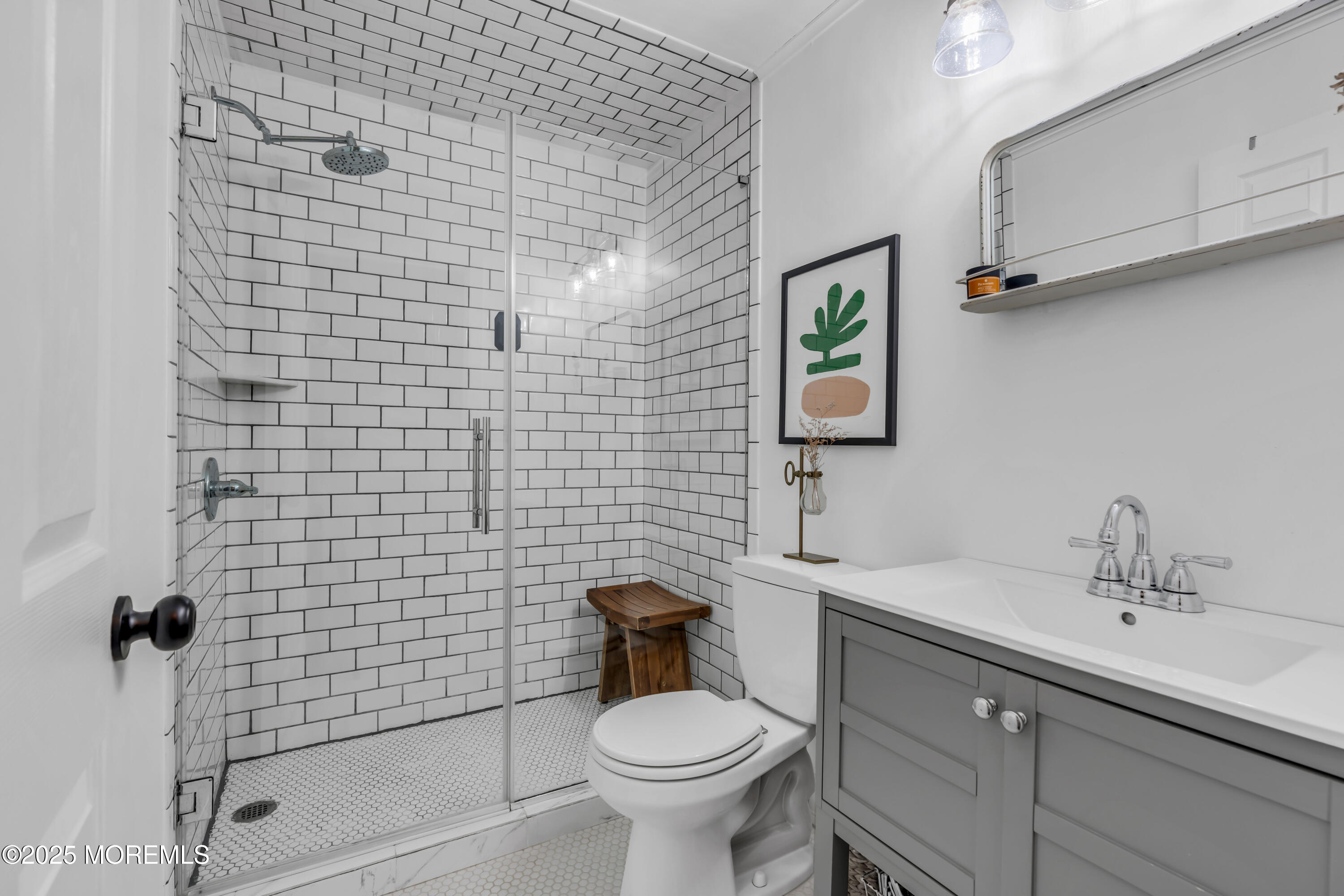2228 Wilson Road Point Pleasant, NJ 08742 - Photo 34 of 65 a bathroom with a sink a toilet and shower
