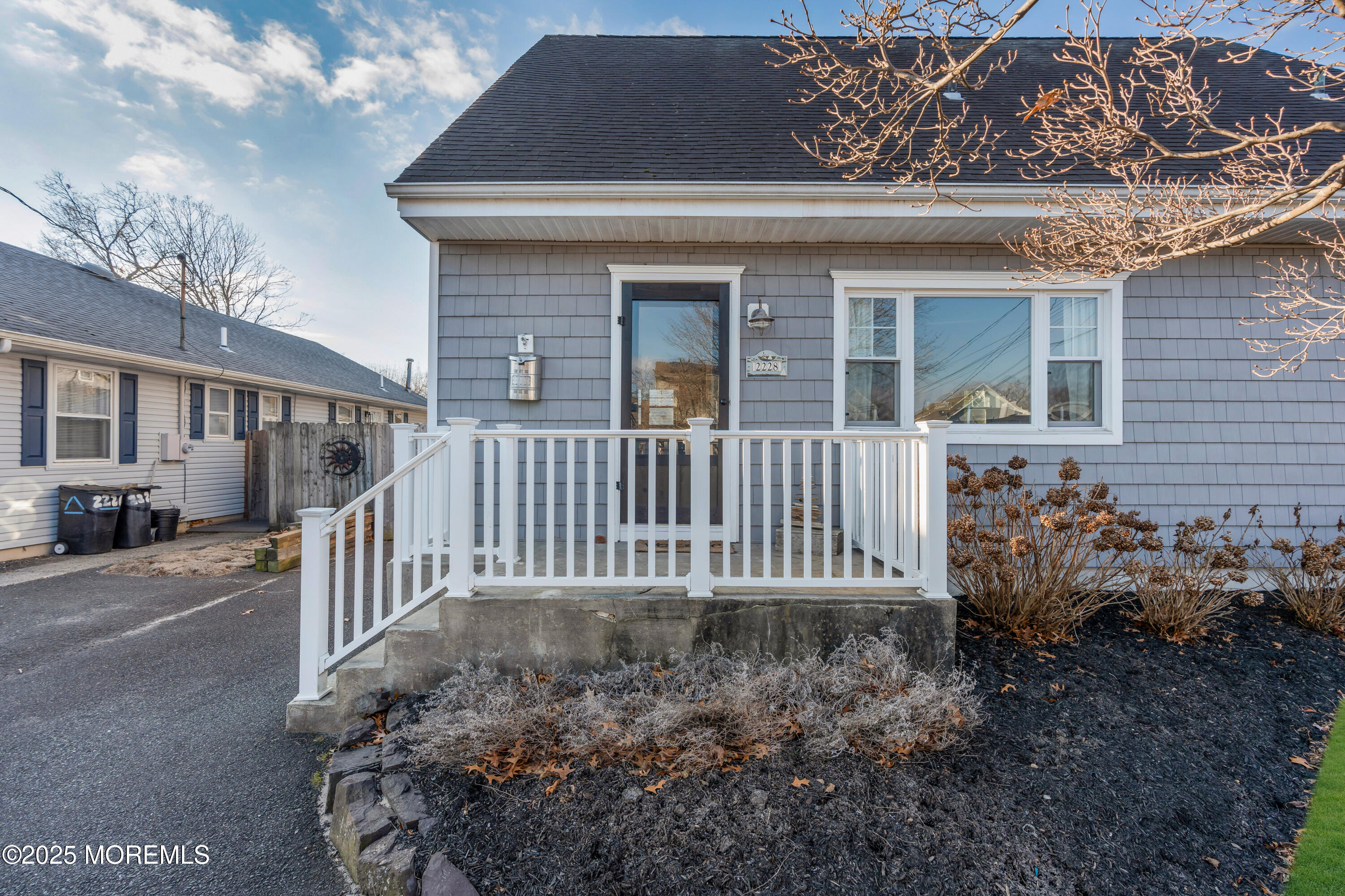 2228 Wilson Road Point Pleasant, NJ 08742 - Photo 4 of 65 a front view of a house with garden