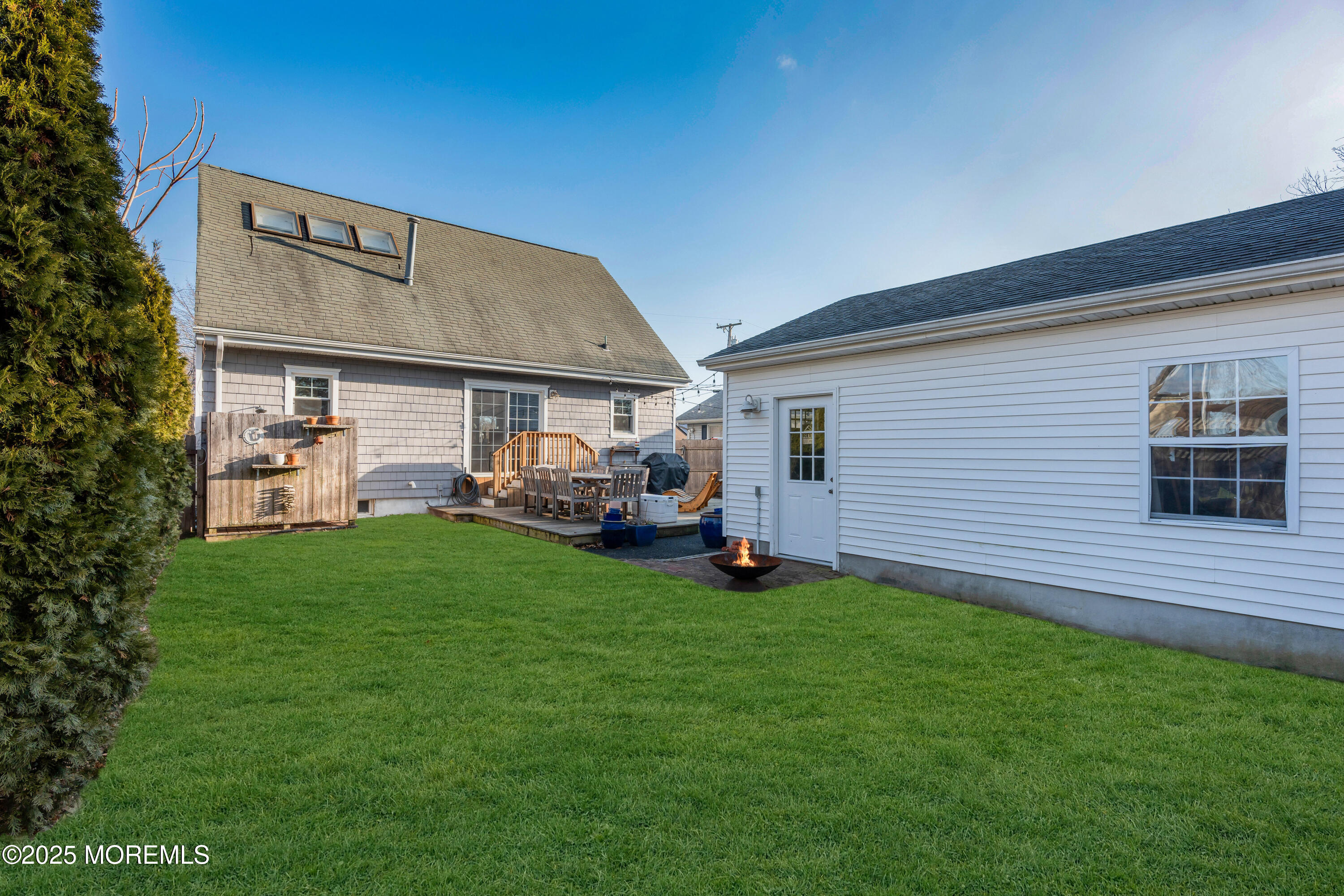 2228 Wilson Road Point Pleasant, NJ 08742 - Photo 58 of 65 a front view of a house with a garden