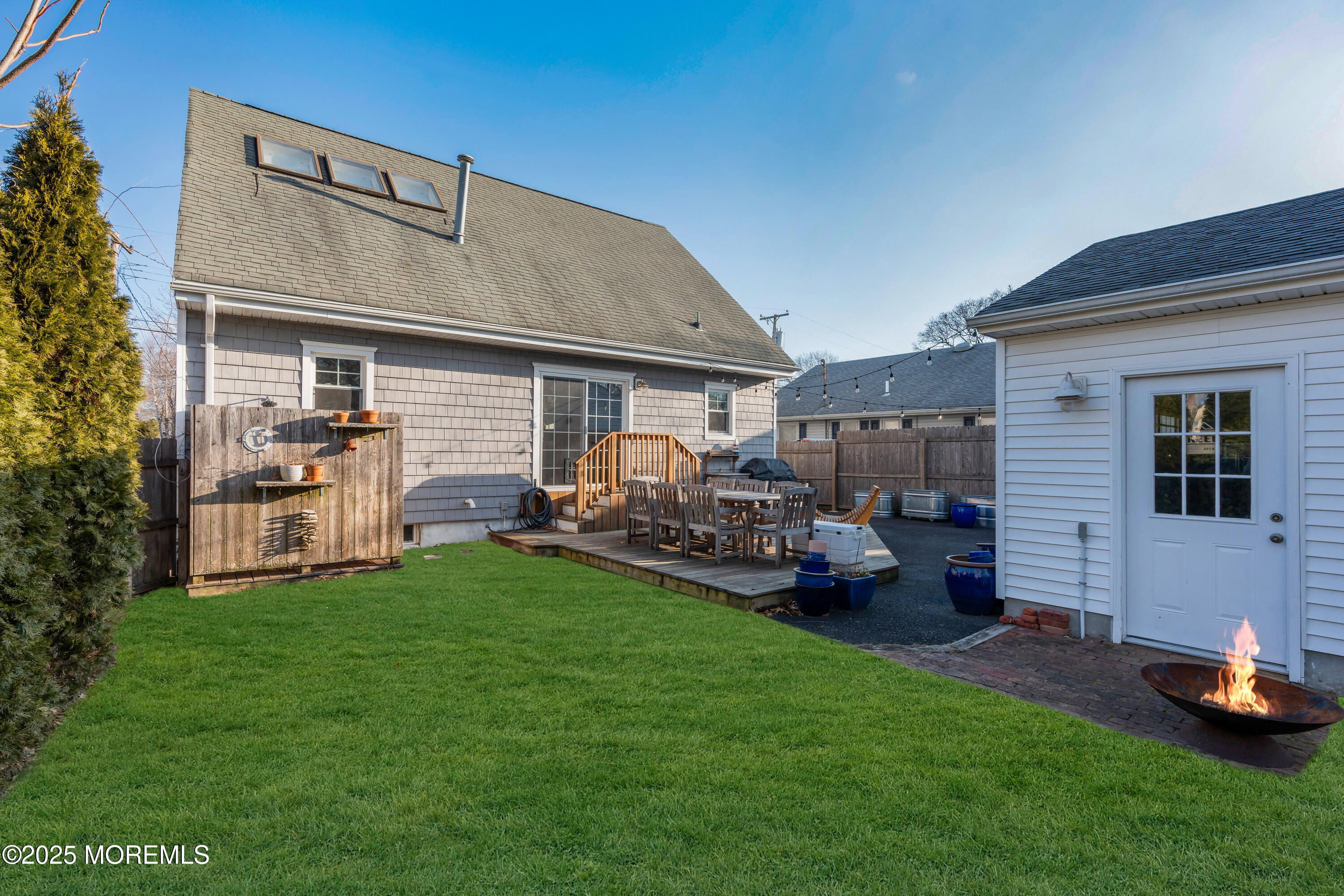 2228 Wilson Road Point Pleasant, NJ 08742 - Photo 59 of 65 a front view of a house with patio and garden
