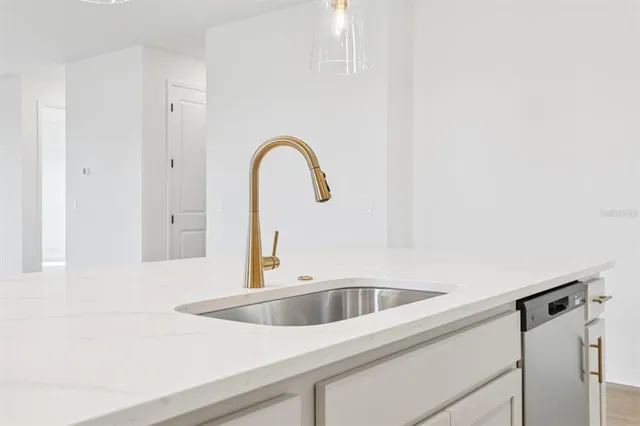 a bathroom with a sink a mirror and toilet