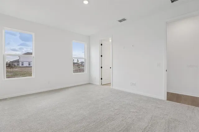 a bathroom with a double vanity sink mirror and double