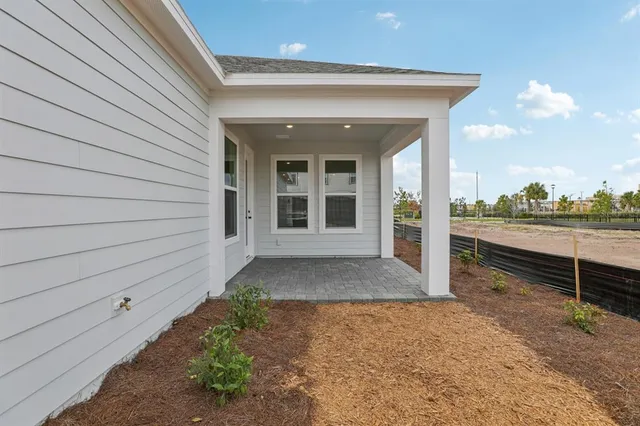 a view of a swimming pool with a lawn chairs