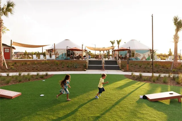 a view of a lake with outdoor seating and city view