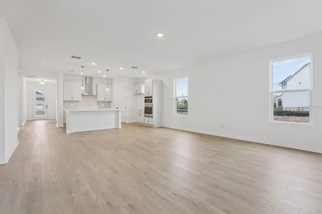 a view of kitchen view wooden floor and window
