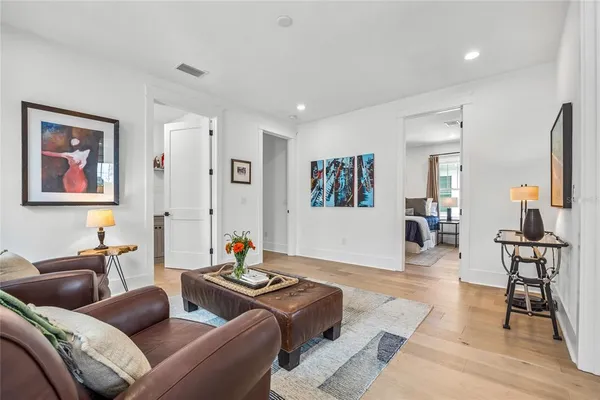 a living room with furniture or couch and a bookshelf