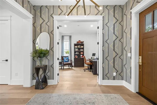 a bathroom with a granite countertop toilet sink and a mirror