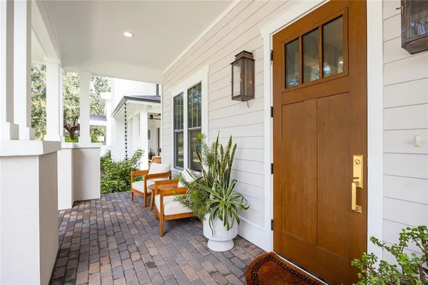 a potted plant sitting in front of a door