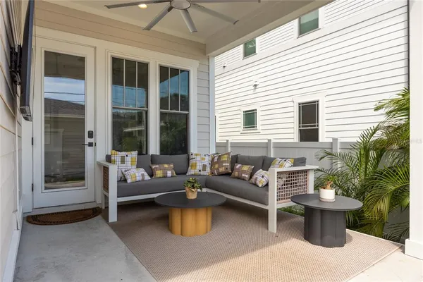 a view of a house with a yard and sitting area