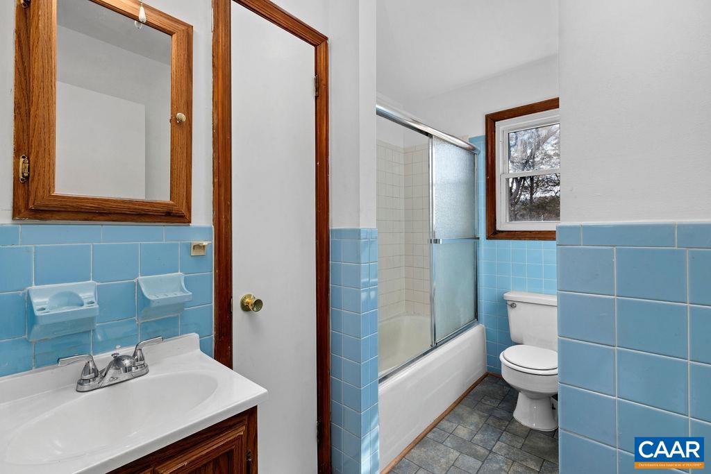 492 Avon Road Afton, VA 22920 - Photo 29 of 60 a bathroom with a toilet a sink and a mirror