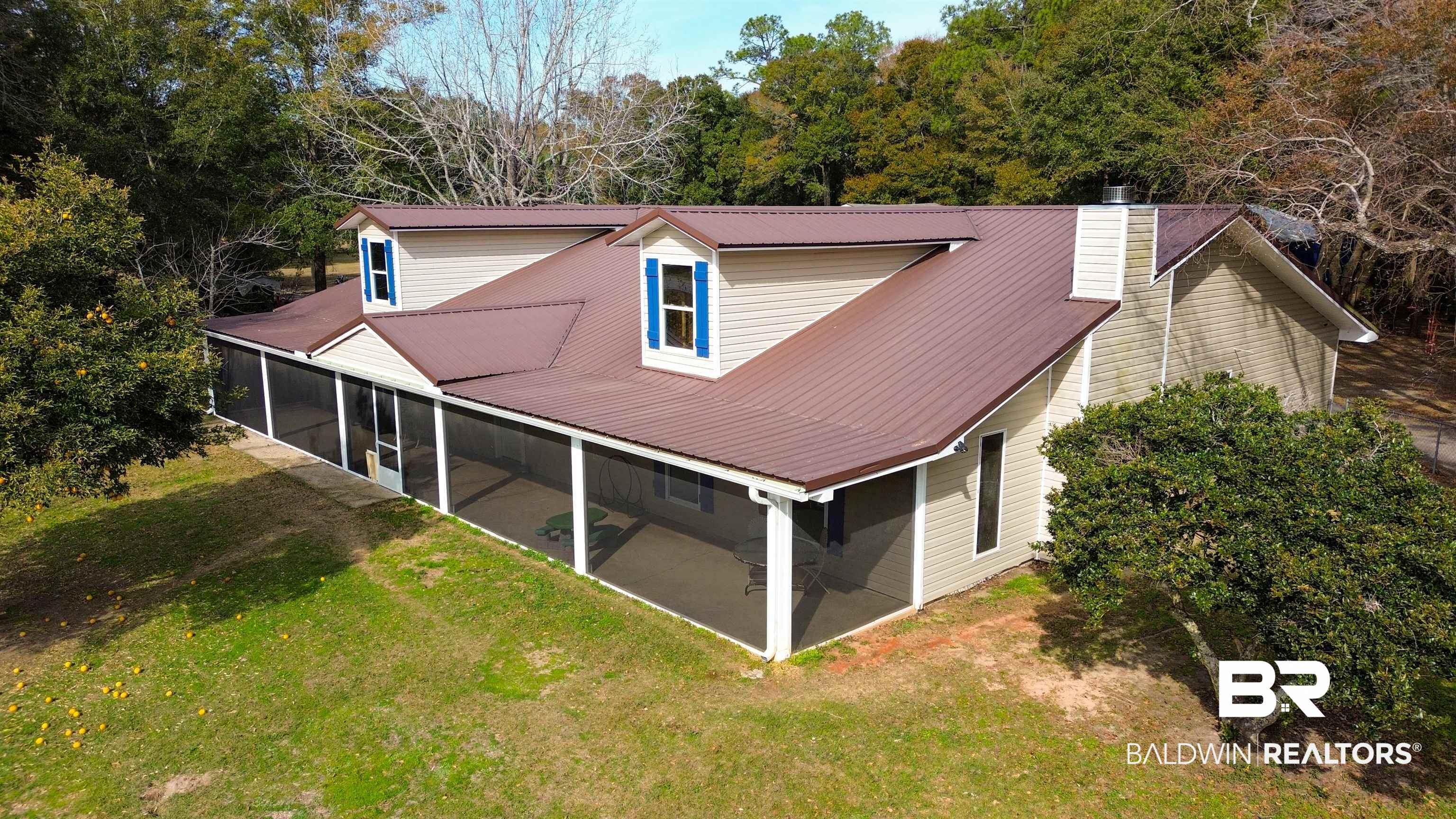 19365 Keller Road Foley, AL 36535 - Photo 2 of 41 Rear view of house featuring a yard and a sunroom