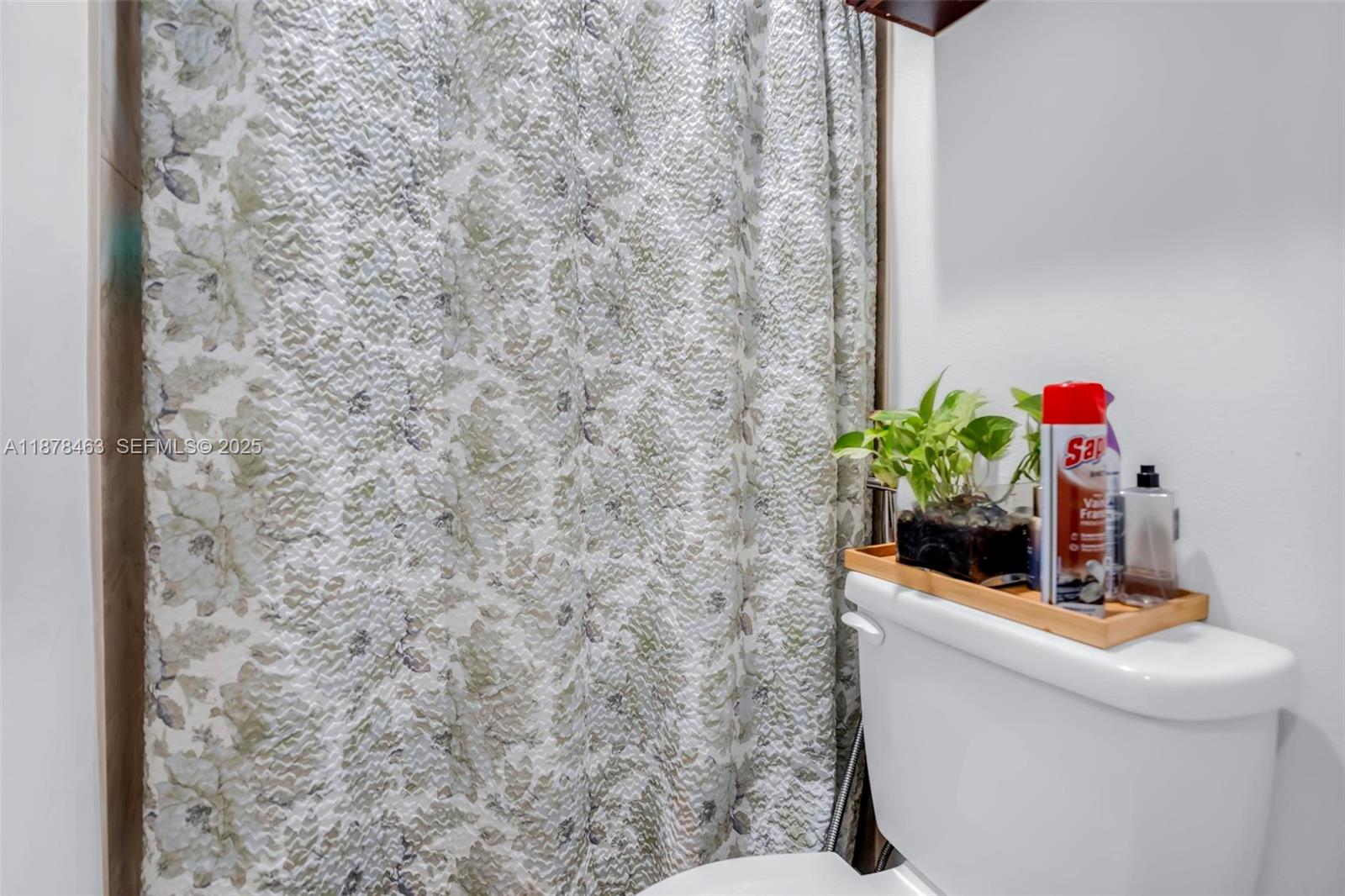 580 Southeast 2nd Street Hialeah, FL 33010 - Photo 13 of 30 a bathroom with a sink a toilet and a mirror