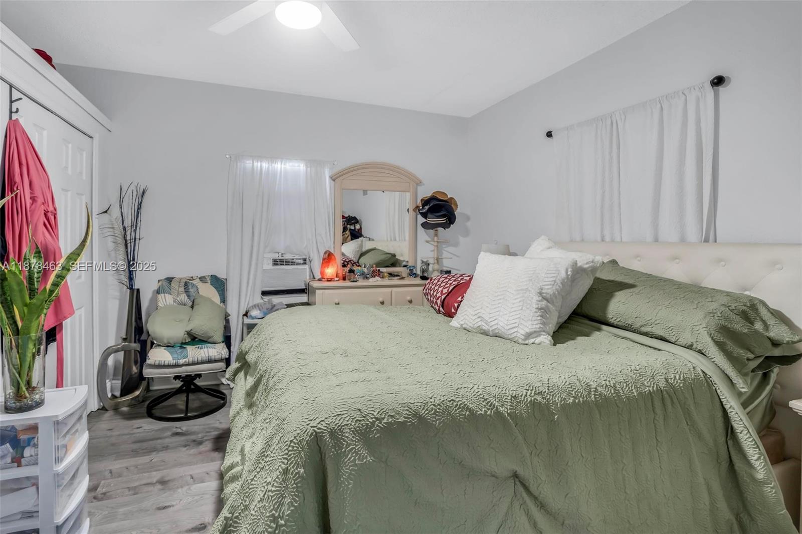 580 Southeast 2nd Street Hialeah, FL 33010 - Photo 14 of 30 a bed sitting in a bedroom next to a window