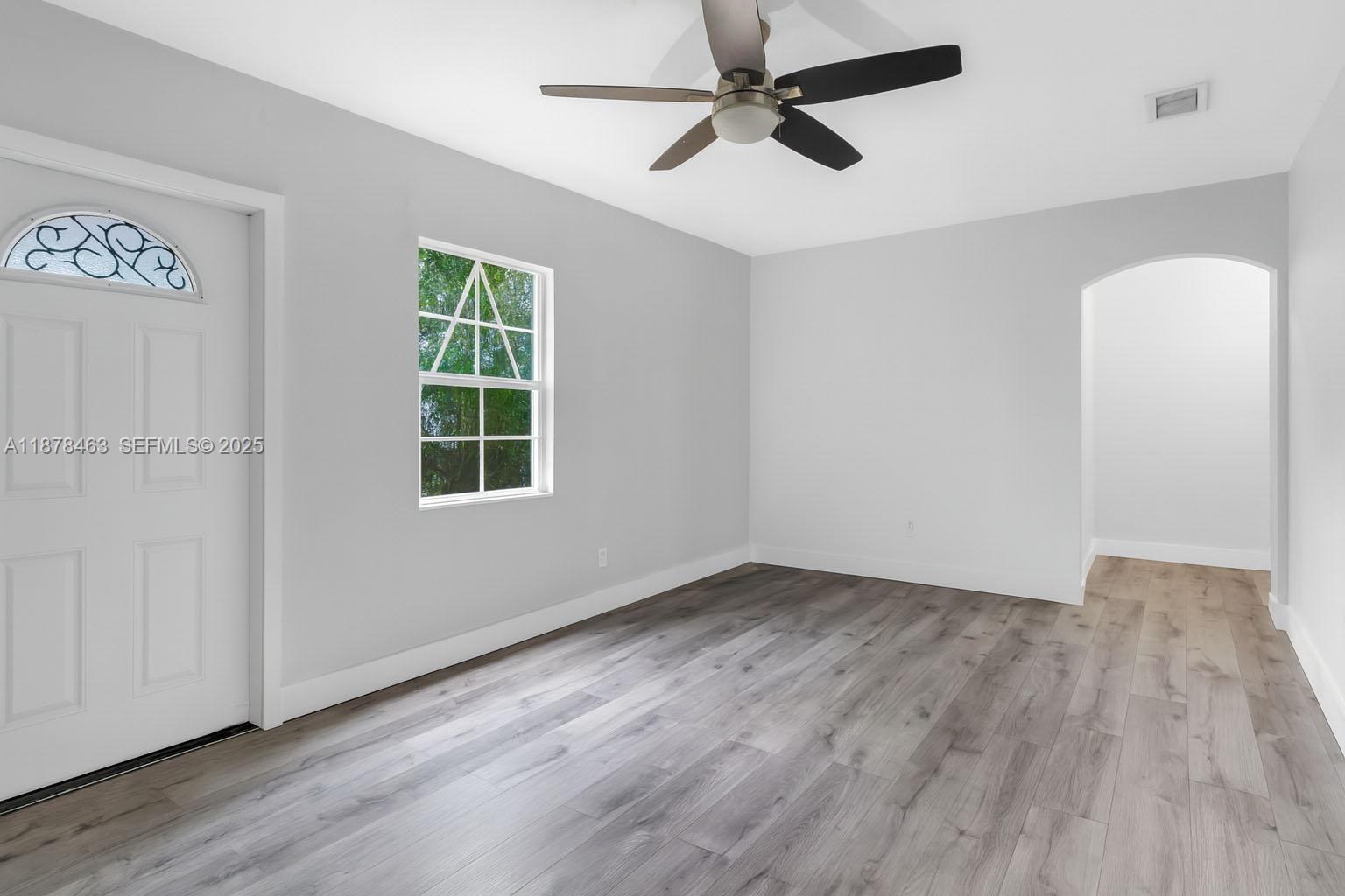580 Southeast 2nd Street Hialeah, FL 33010 - Photo 4 of 30 a view of empty room with wooden floor and fan