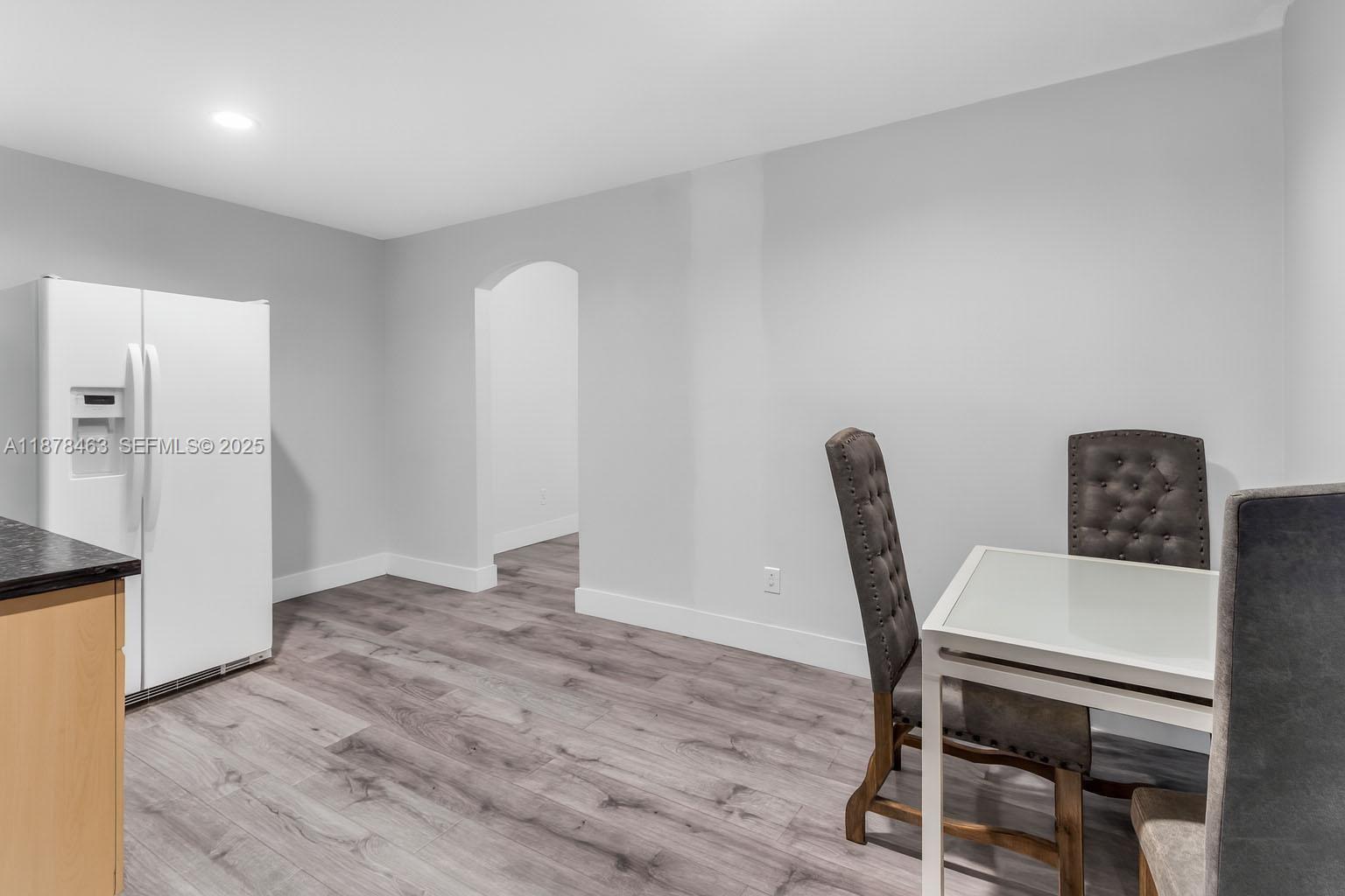 580 Southeast 2nd Street Hialeah, FL 33010 - Photo 6 of 30 a workspace with furniture and wooden floor