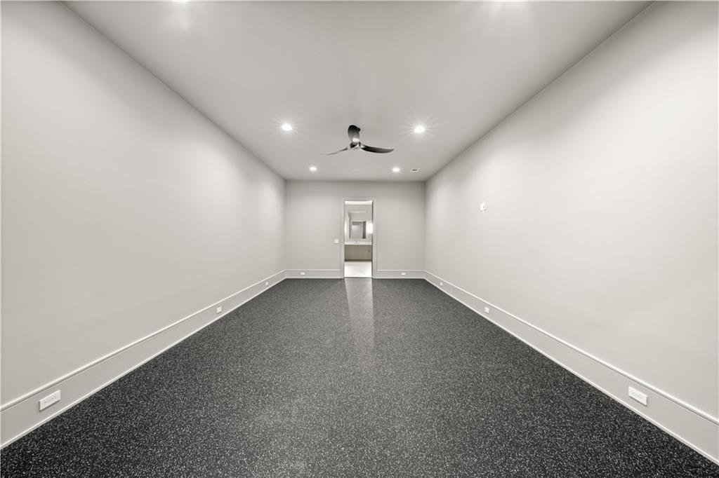 5211 Powers Ferry Road Northwest Sandy Springs, GA 30327 - Photo 76 of 106 an empty room with a empty space and windows